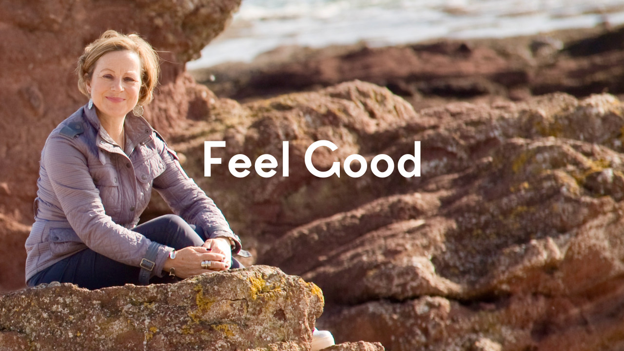 Alisoun Mackenzie sitting on rocks